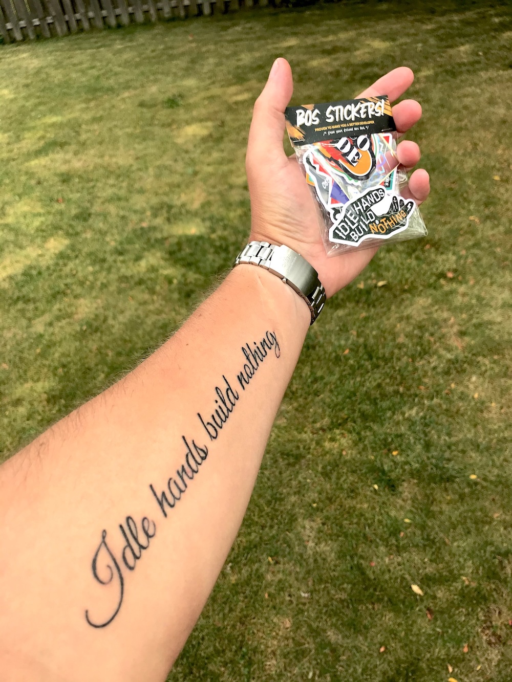 Tattoo on my arm with the words Idle hands build nothing